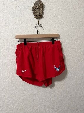 Nike Women's Red Athletic Shorts with Blue Air Force Emblem